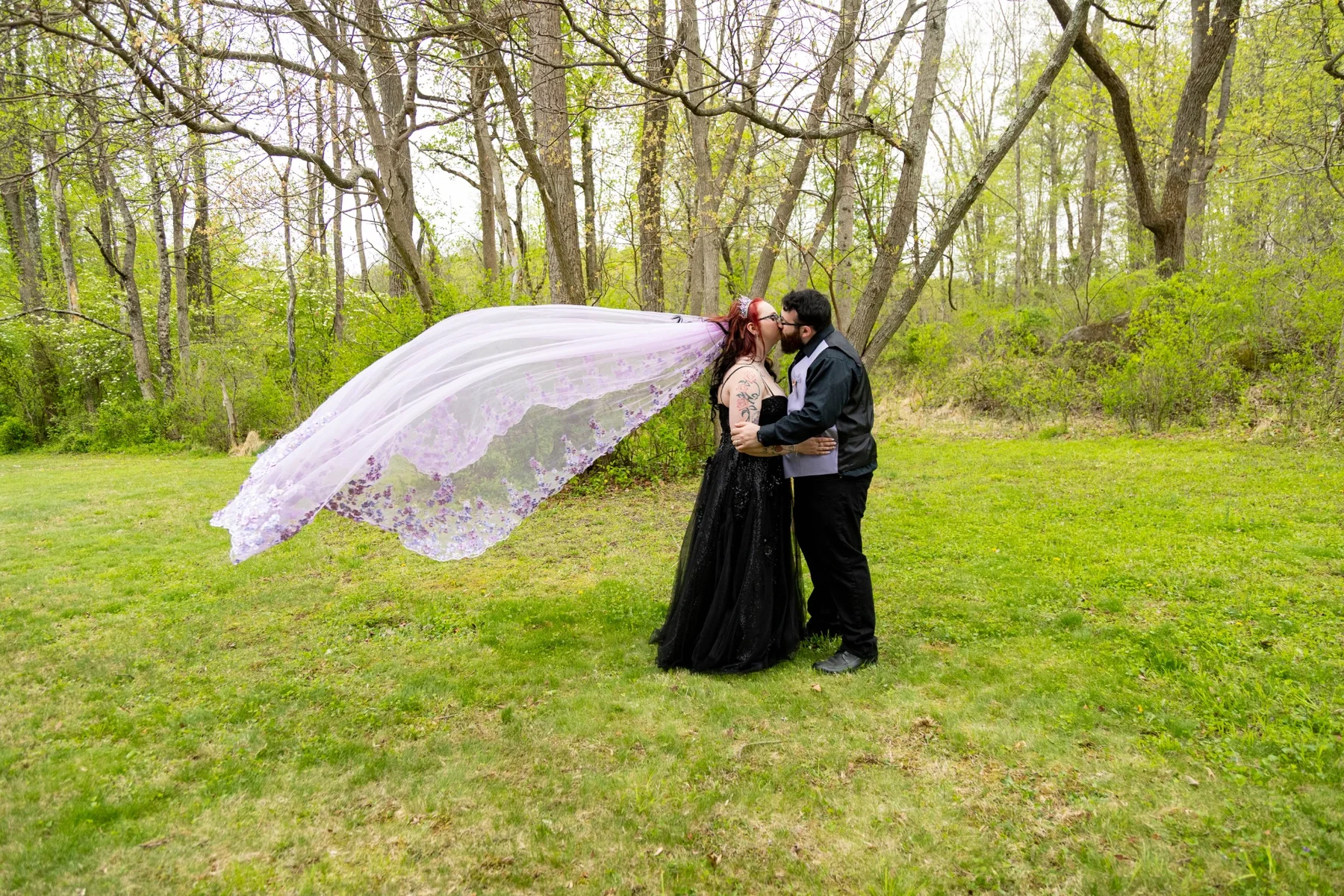 Wedding couple with a dramatic flowing veil